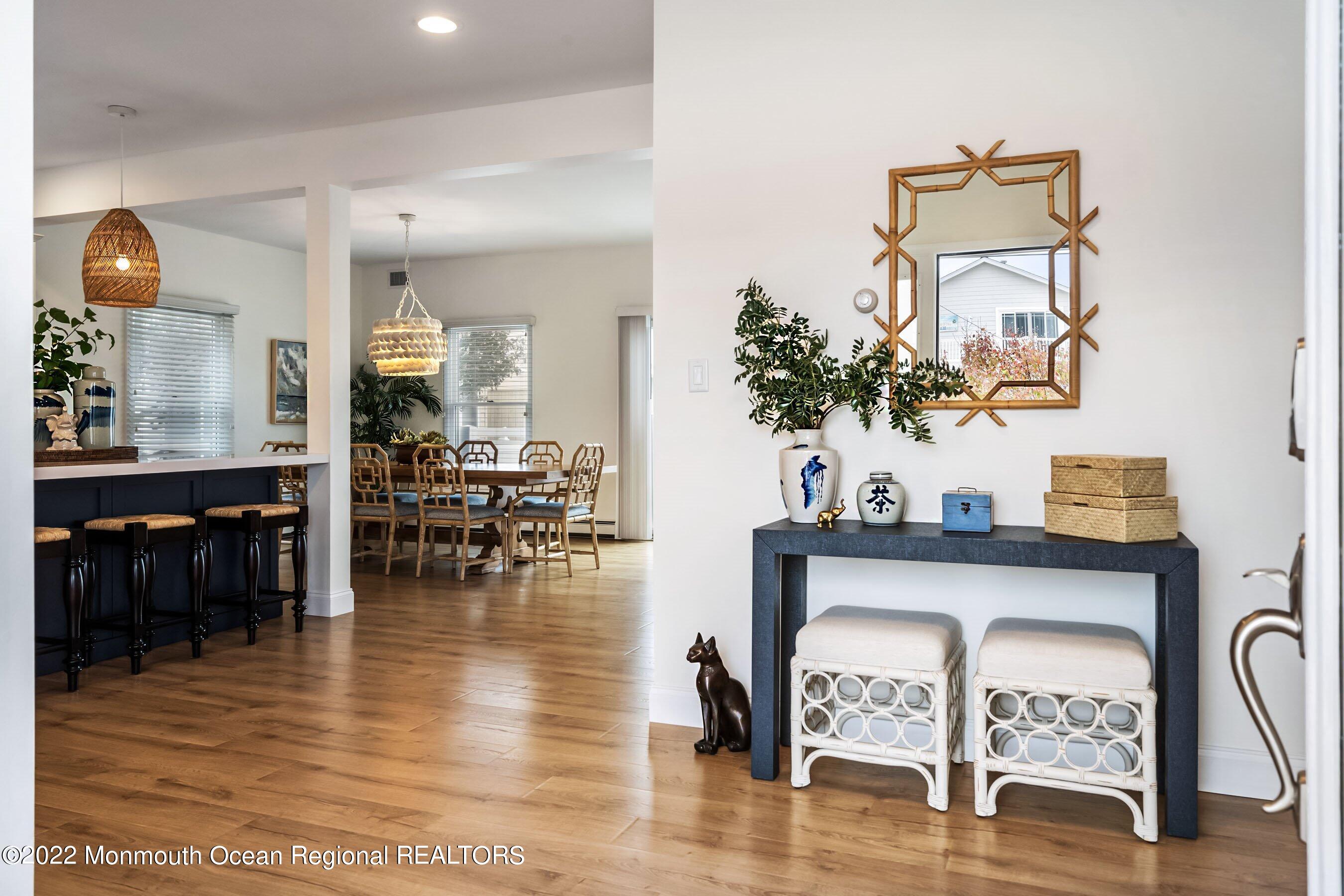 23 Magee Avenue, Unit SUMMER Lavallette, NJ 08735 - Photo 5 of 34 a view of living room and kitchen with furniture and wooden floor