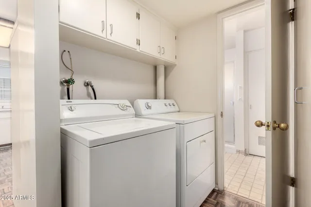 a utility room with dryer and washer