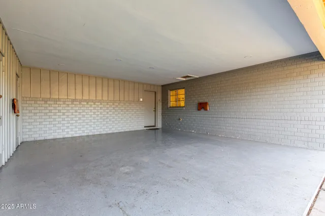 a view of an empty room and a window