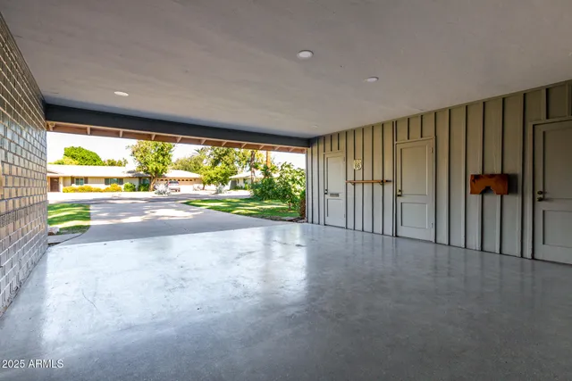 a view of a backyard with plants and a patio