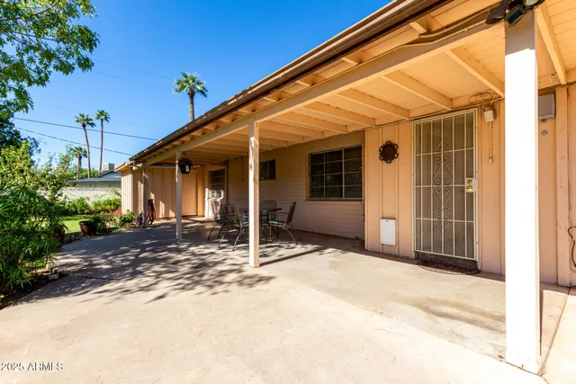 a view of yard with swimming pool and green space