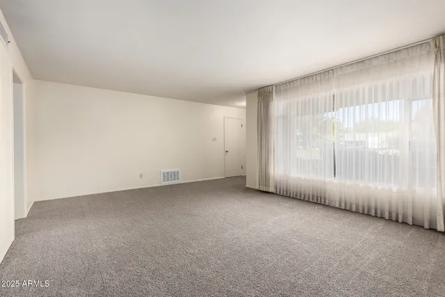 an empty room with windows