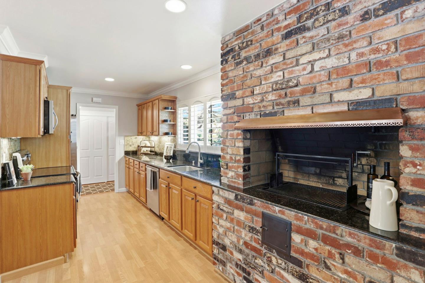 1701 Springer Road Mountain View, CA 94040 - Photo 13 of 48 a large kitchen with stainless steel appliances granite countertop a stove and a sink