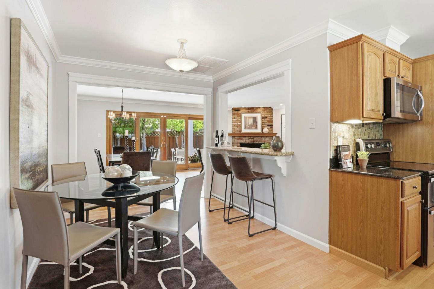 1701 Springer Road Mountain View, CA 94040 - Photo 15 of 48 a view of a dining room with furniture a kitchen and chandelier