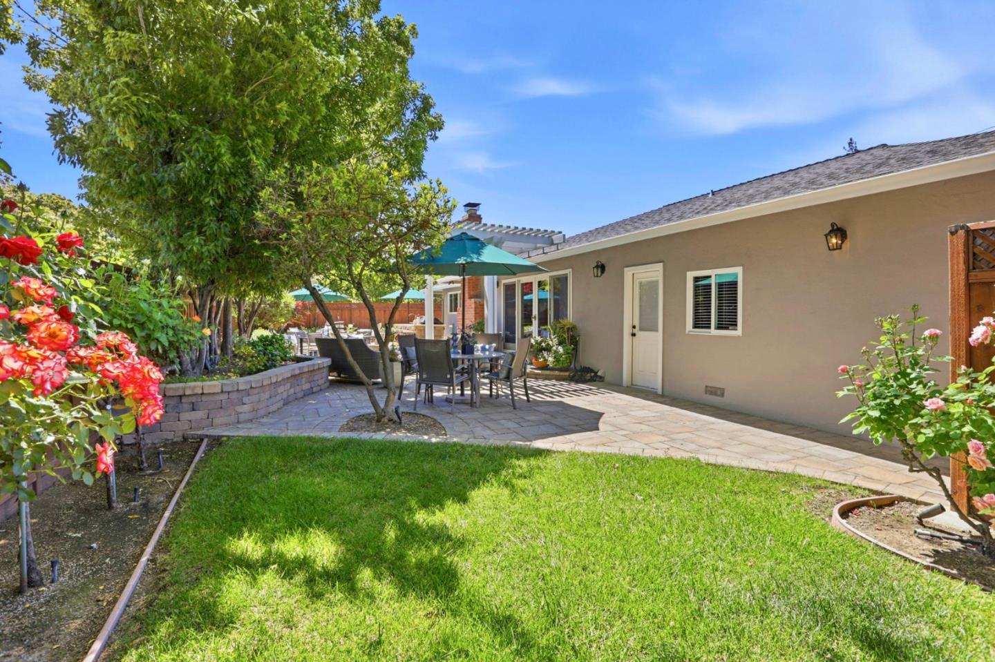 1701 Springer Road Mountain View, CA 94040 - Photo 28 of 48 a view of backyard of house with outdoor seating and green space