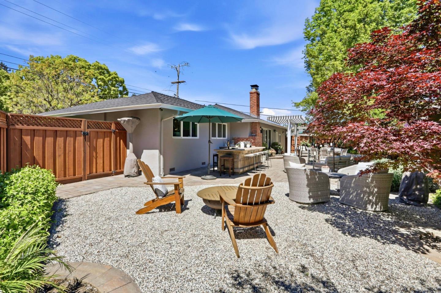 1701 Springer Road Mountain View, CA 94040 - Photo 33 of 48 a backyard of a house with table and chairs