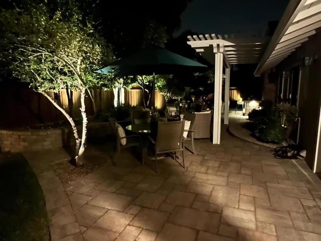1701 Springer Road Mountain View, CA 94040 - Photo 37 of 48 a view of a patio with a table and chairs under an umbrella