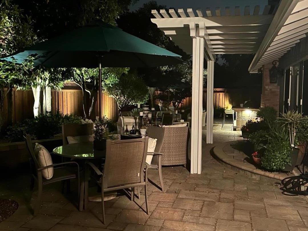 1701 Springer Road Mountain View, CA 94040 - Photo 39 of 48 a view of a patio with table and chairs under an umbrella