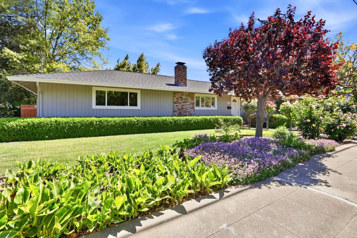1701 Springer Road Mountain View, CA 94040 - Photo 4 of 48 a front view of a house with a garden