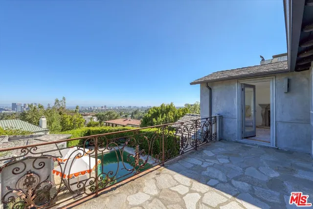a view of a balcony with furniture