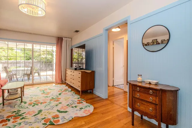 a bedroom with a bed closet and a large window