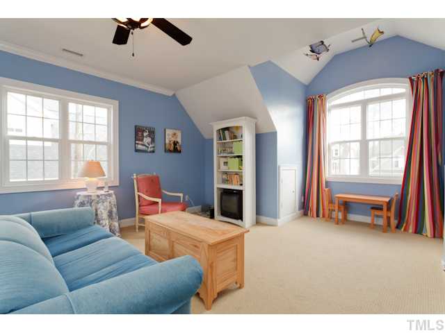 4216 Oakthorne Way Raleigh, NC 27613 - Photo 18 of 24 a living room with furniture and a window