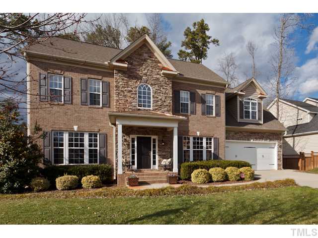 4216 Oakthorne Way Raleigh, NC 27613 - Photo 2 of 24 a front view of a house with garden