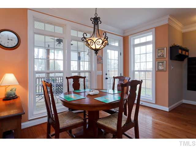 4216 Oakthorne Way Raleigh, NC 27613 - Photo 5 of 24 a view of a dining room with furniture window and wooden floor