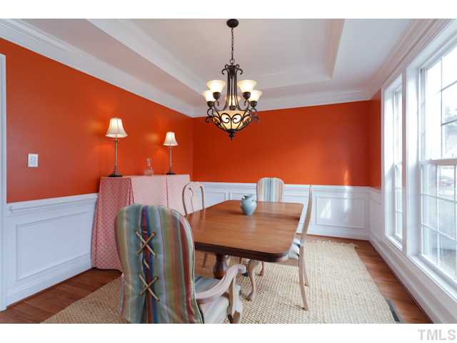 4216 Oakthorne Way Raleigh, NC 27613 - Photo 6 of 24 a view of a dining room with furniture and chandelier