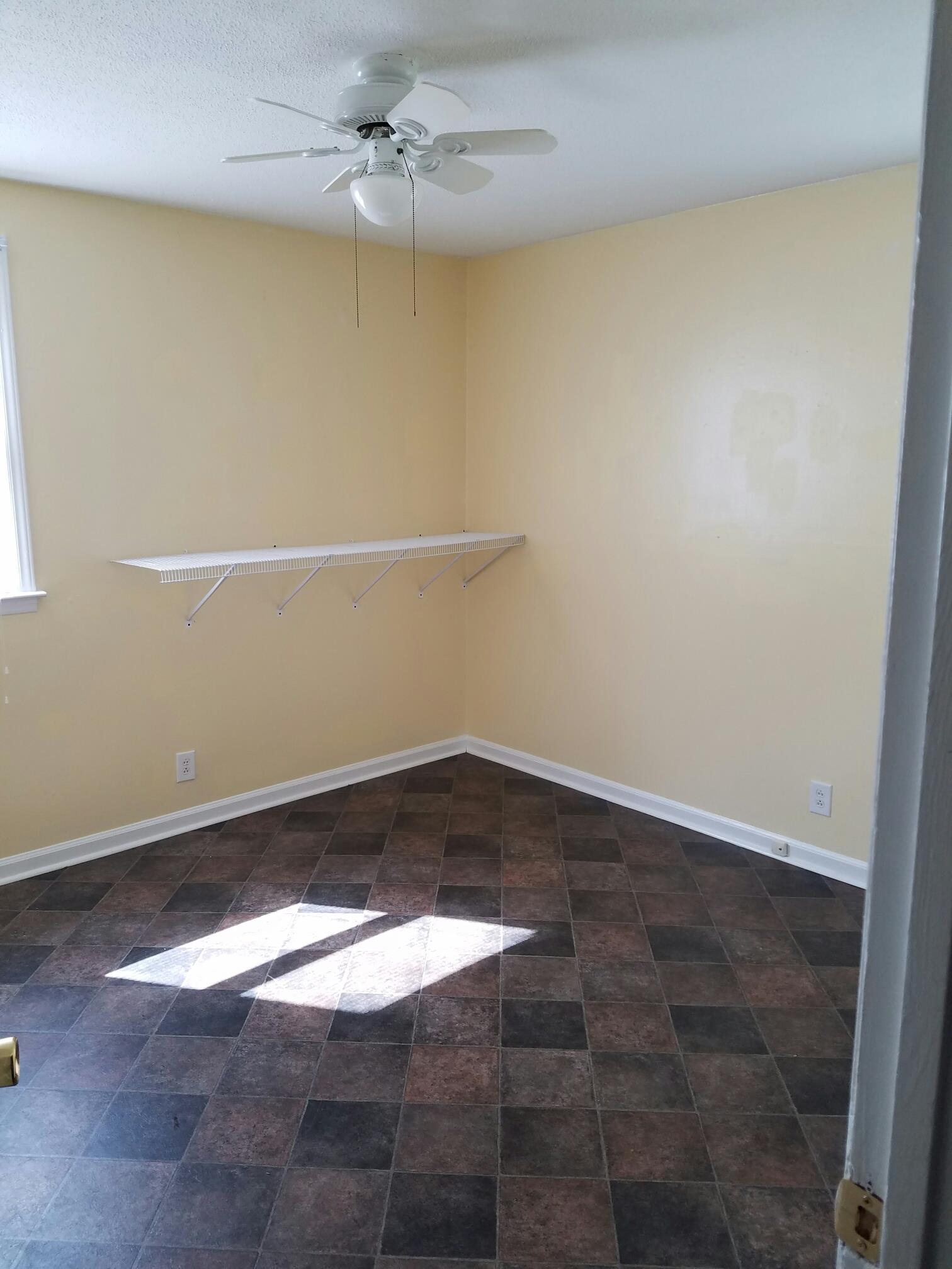2430 Moody Road Clarksville, TN 37040 - Photo 8 of 15 a view of a big room with wooden floor and fan