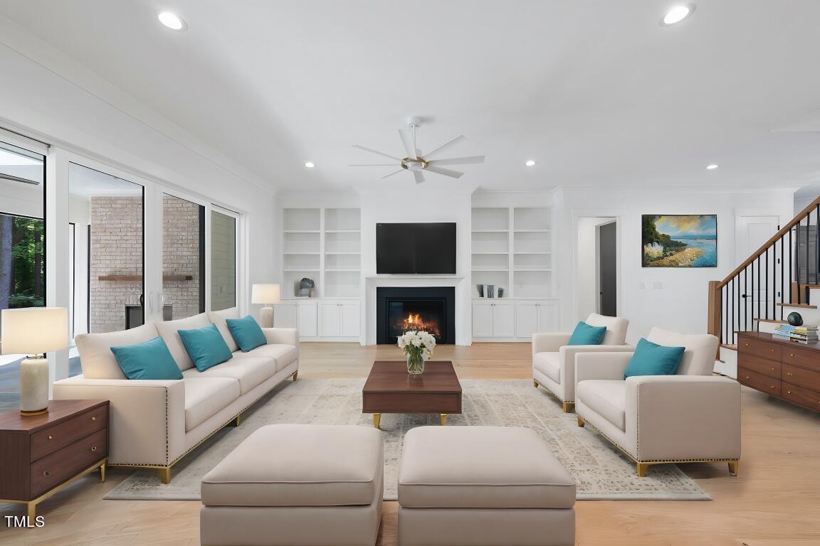 412 Vernon Terrace Raleigh, NC 27609 - Photo 11 of 67 a living room with furniture flat screen tv and a fireplace