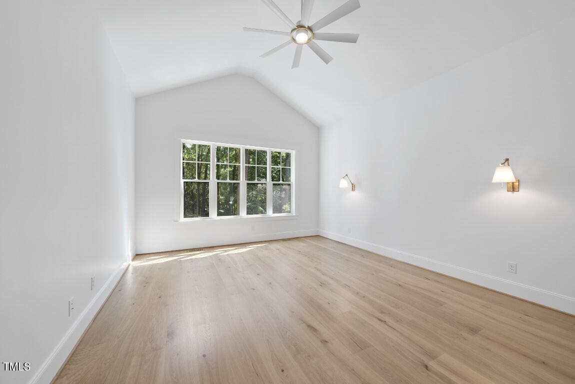 412 Vernon Terrace Raleigh, NC 27609 - Photo 22 of 67 wooden floor in an empty room with a window