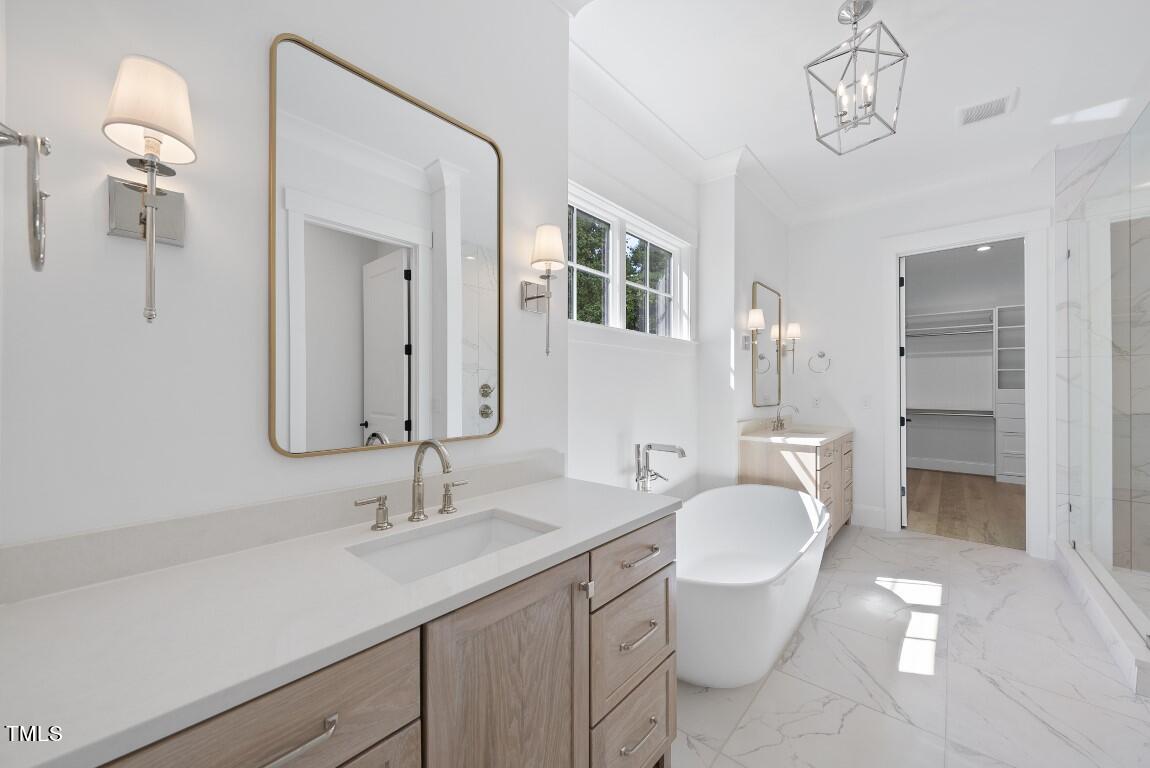 412 Vernon Terrace Raleigh, NC 27609 - Photo 25 of 67 a bathroom with a granite countertop sink a toilet and a mirror