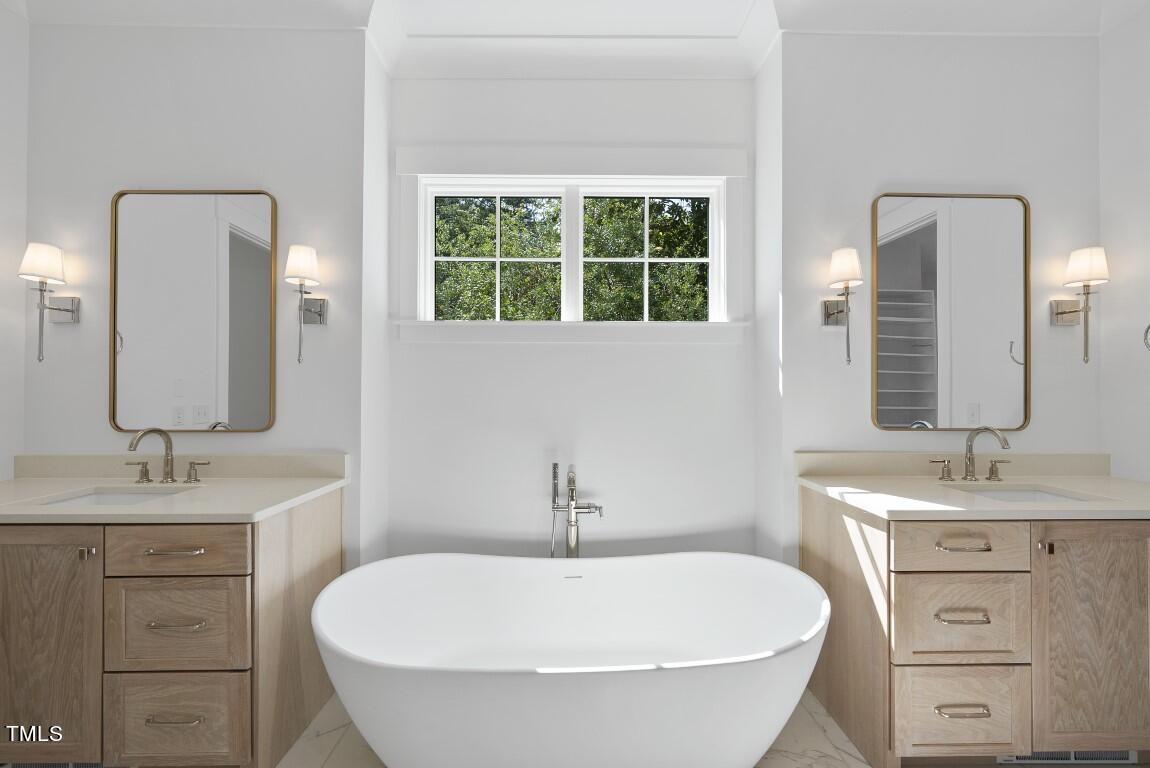 412 Vernon Terrace Raleigh, NC 27609 - Photo 26 of 67 a bathroom with a granite countertop sink and a mirror