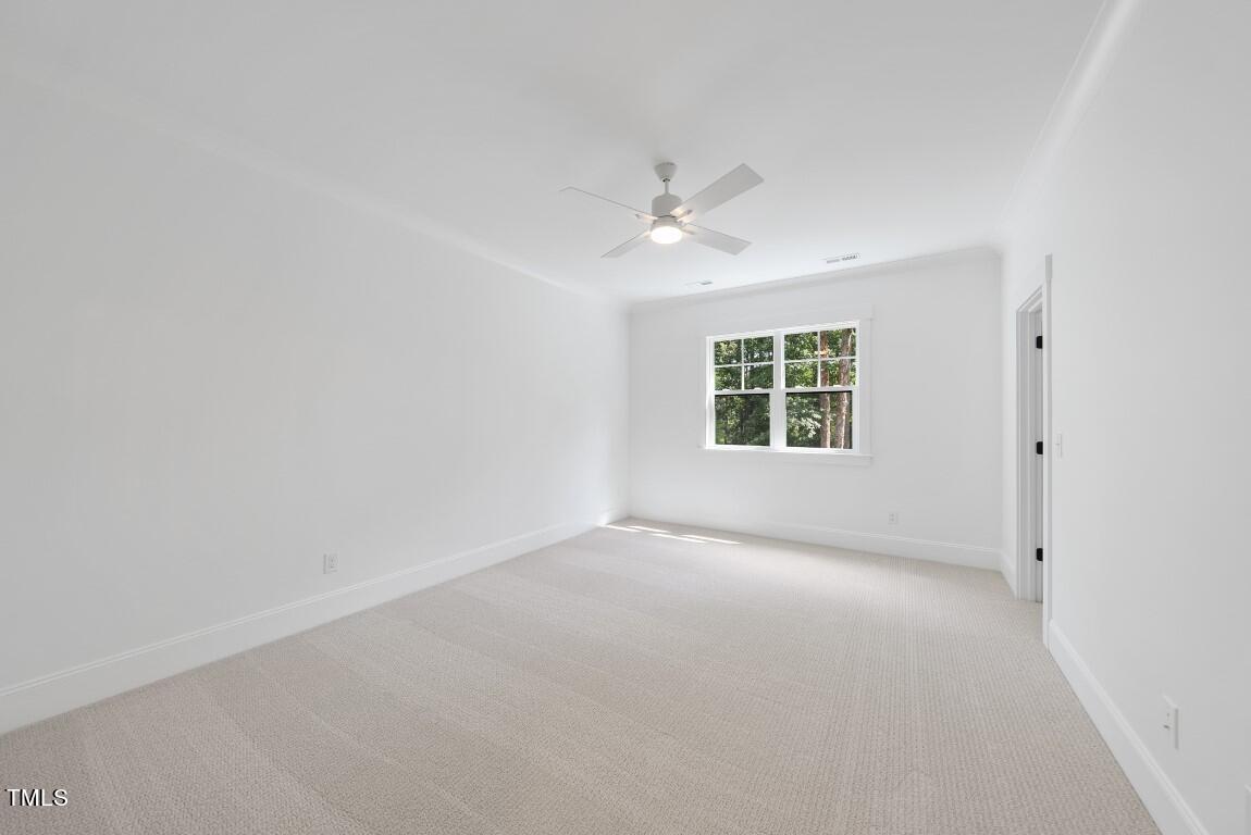 412 Vernon Terrace Raleigh, NC 27609 - Photo 39 of 67 an empty room with a window and a ceiling fan