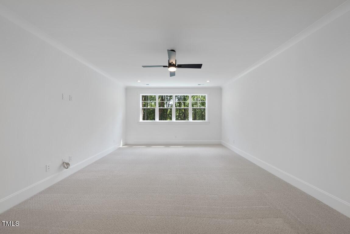 412 Vernon Terrace Raleigh, NC 27609 - Photo 41 of 67 an empty room with a window and a ceiling fan