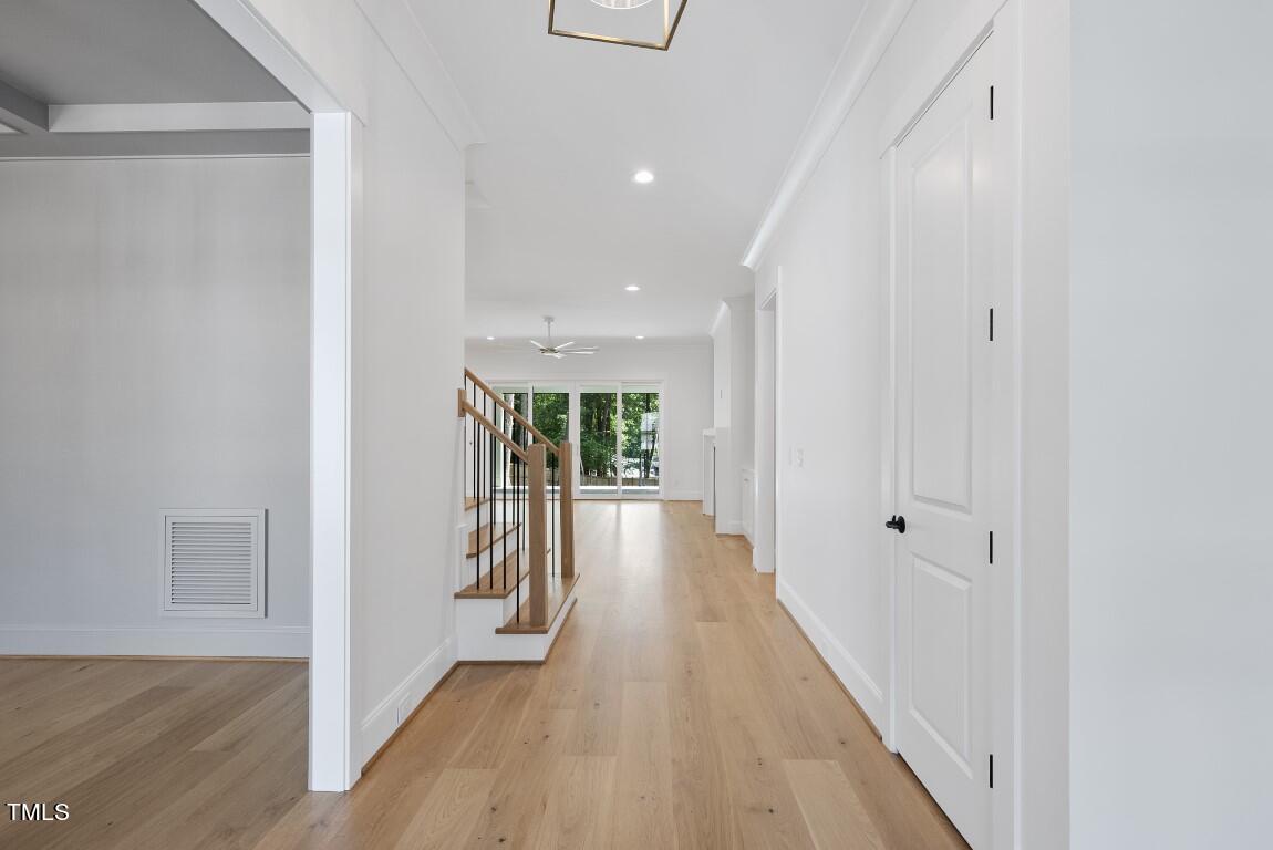 412 Vernon Terrace Raleigh, NC 27609 - Photo 47 of 67 a view of a hallway with wooden floor and staircase