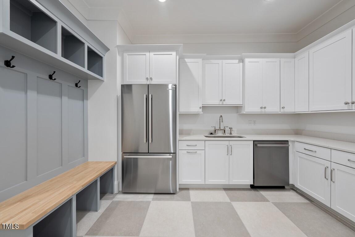 412 Vernon Terrace Raleigh, NC 27609 - Photo 49 of 67 a kitchen with granite countertop a refrigerator and a sink