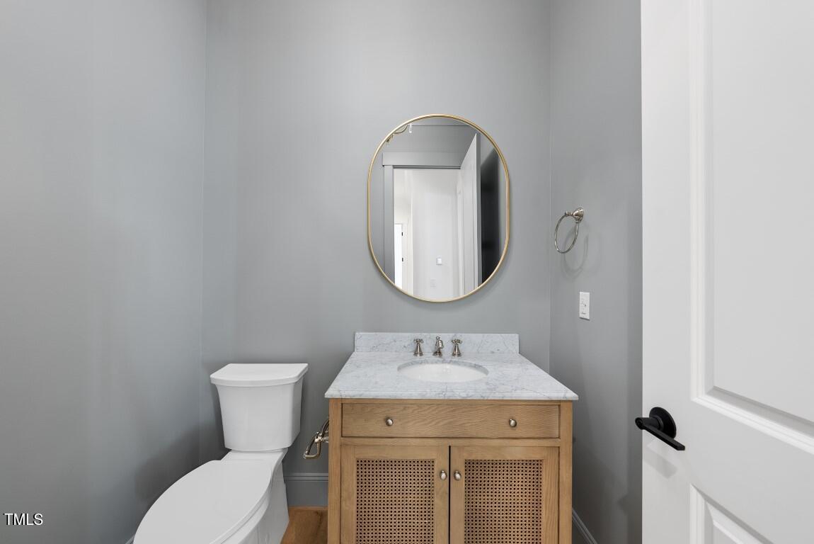 412 Vernon Terrace Raleigh, NC 27609 - Photo 52 of 67 a bathroom with a sink and a mirror