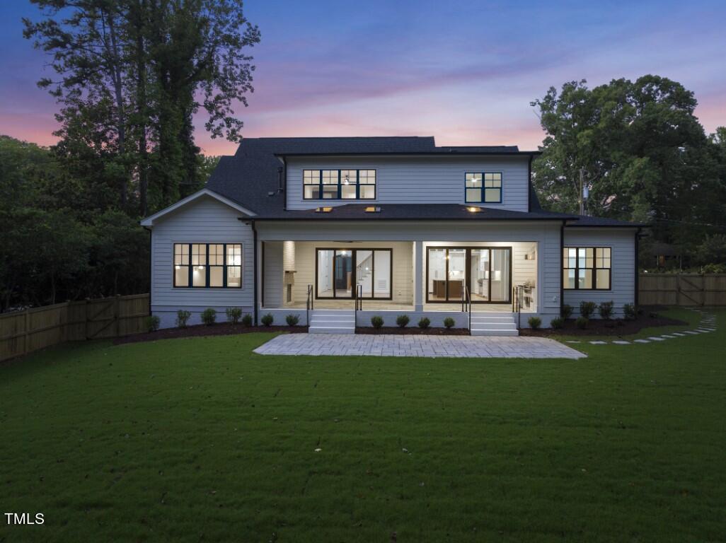 412 Vernon Terrace Raleigh, NC 27609 - Photo 57 of 67 a front view of a house with a yard and outdoor seating