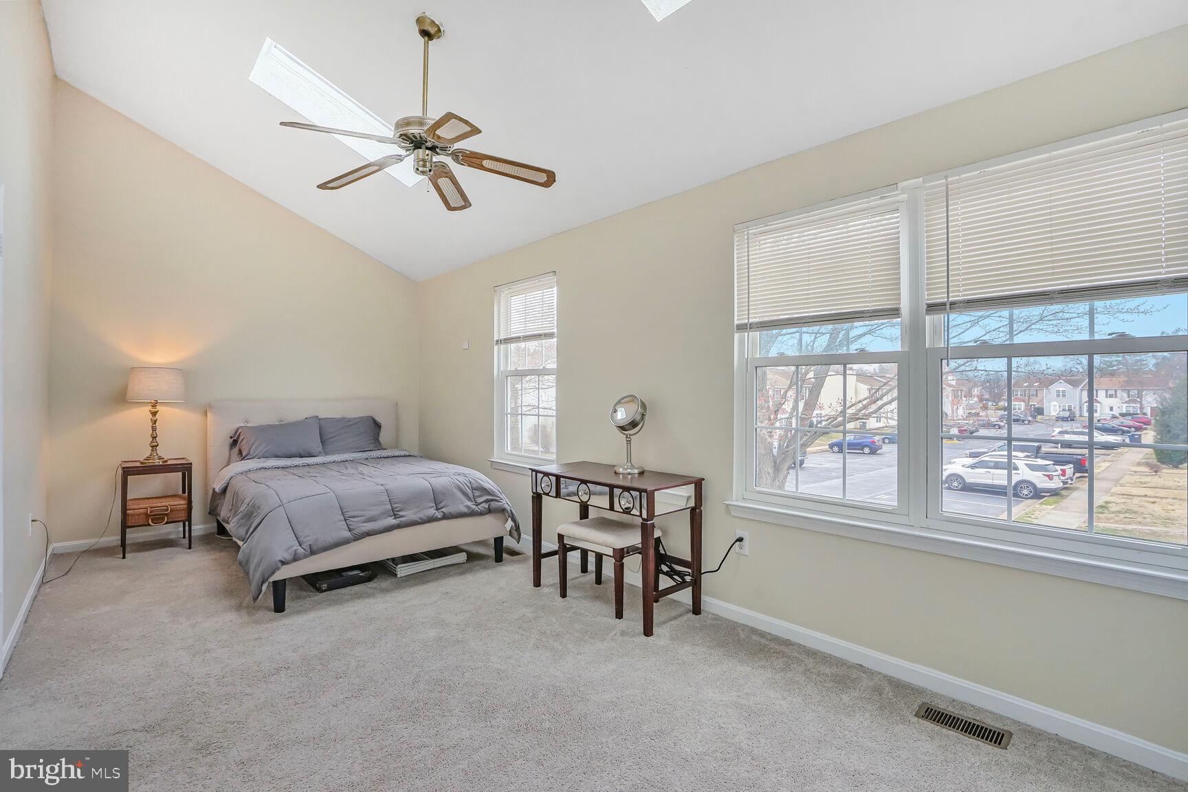7810 Gateshead Lane Manassas, VA 20109 - Photo 12 of 20 a bedroom with a bed and a window