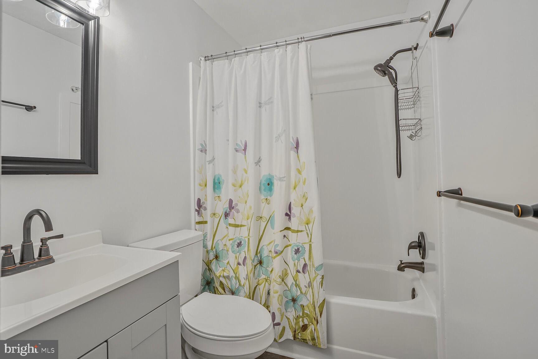 7810 Gateshead Lane Manassas, VA 20109 - Photo 17 of 20 a bathroom with a sink a toilet and shower