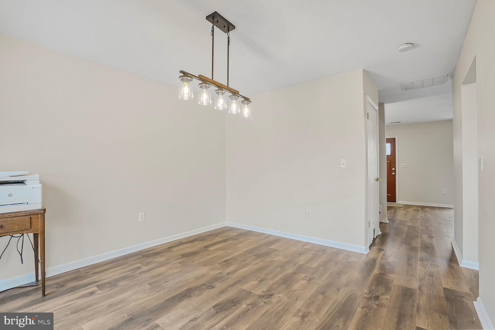 7810 Gateshead Lane Manassas, VA 20109 - Photo 4 of 20 a view of empty room with wooden floor