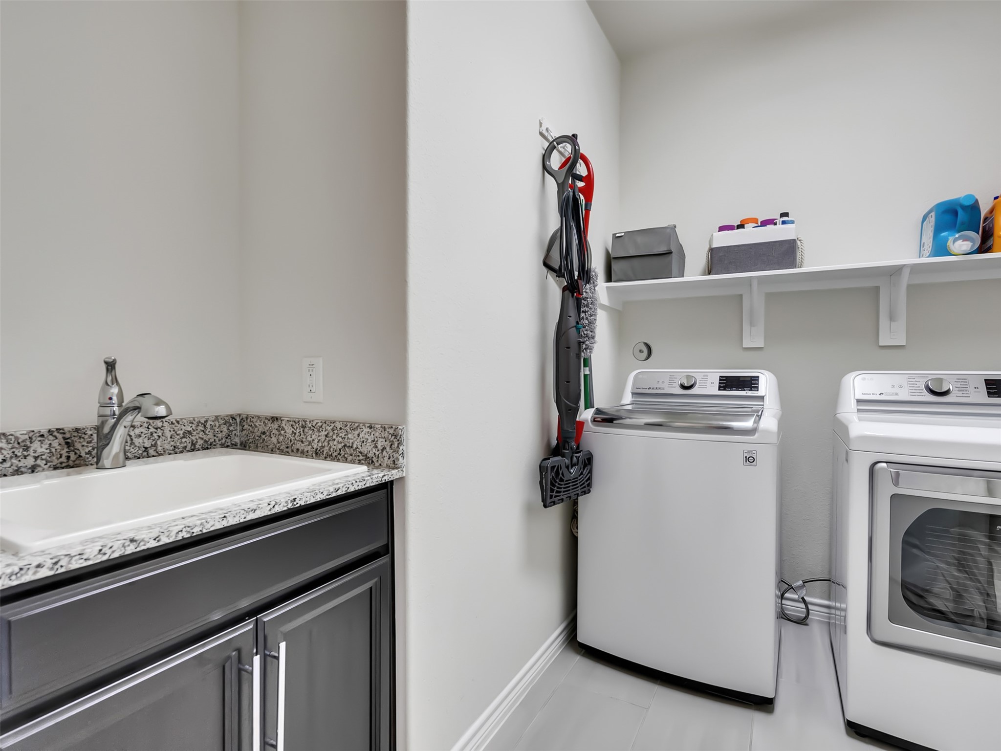 27997 Lone Hollow Lane Spring, TX 77386 - Photo 35 of 45 a utility room with dryer and washer