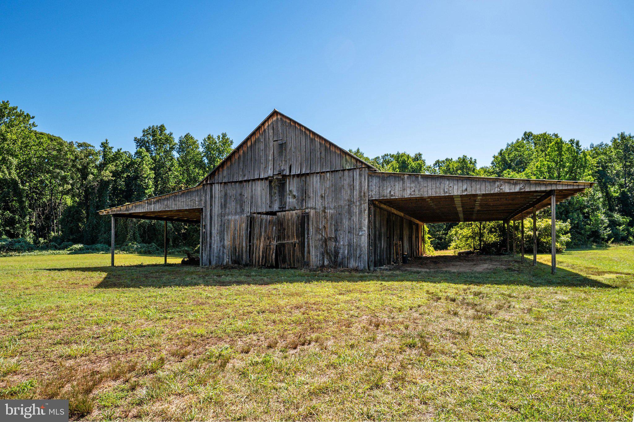 1524 Governor Bridge Road Davidsonville, MD 21035 - Photo 21 of 28 Main barn with covered storage