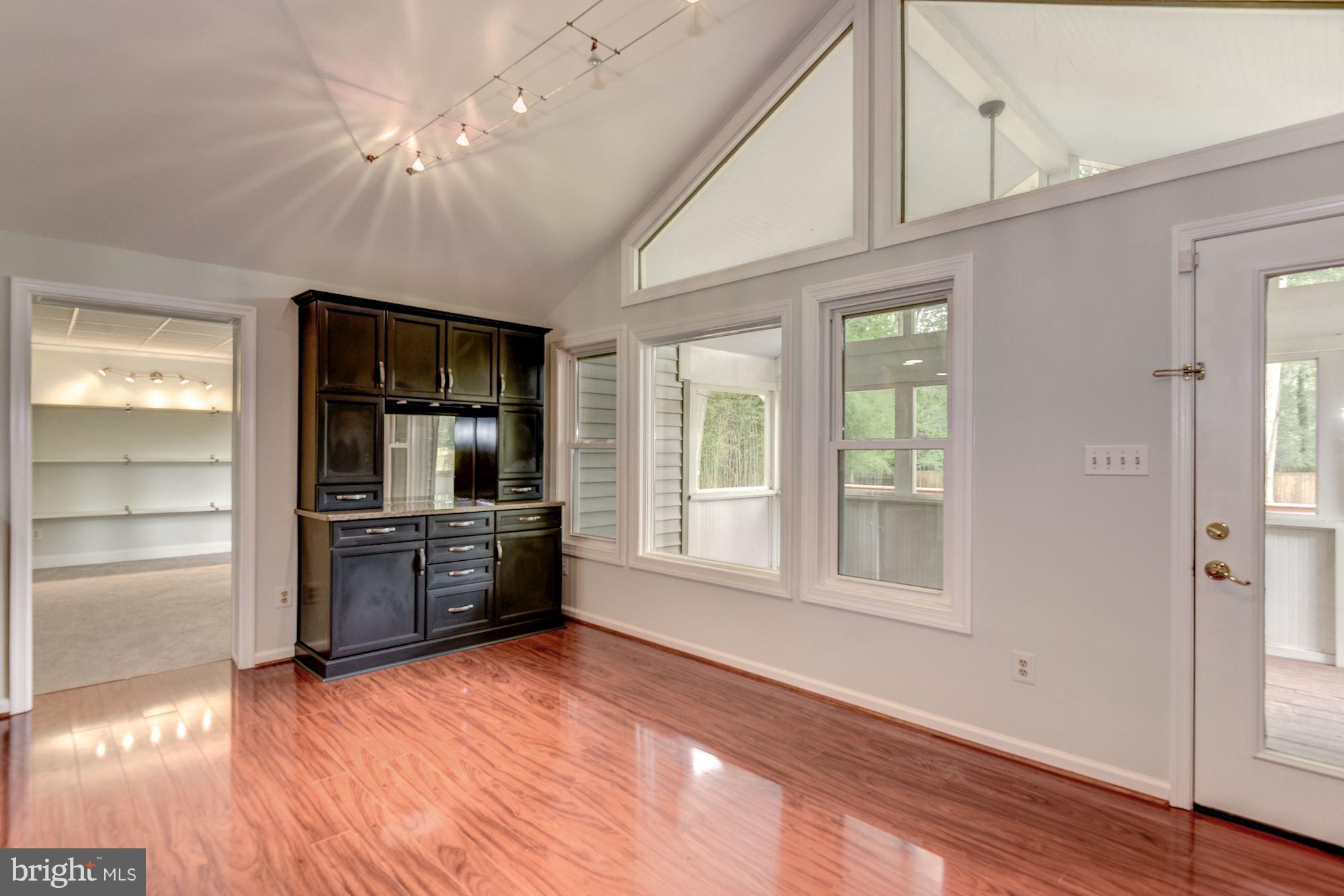 7729 Schelhorn Road Alexandria, VA 22306 - Photo 21 of 30 Dining room opens to screened porch