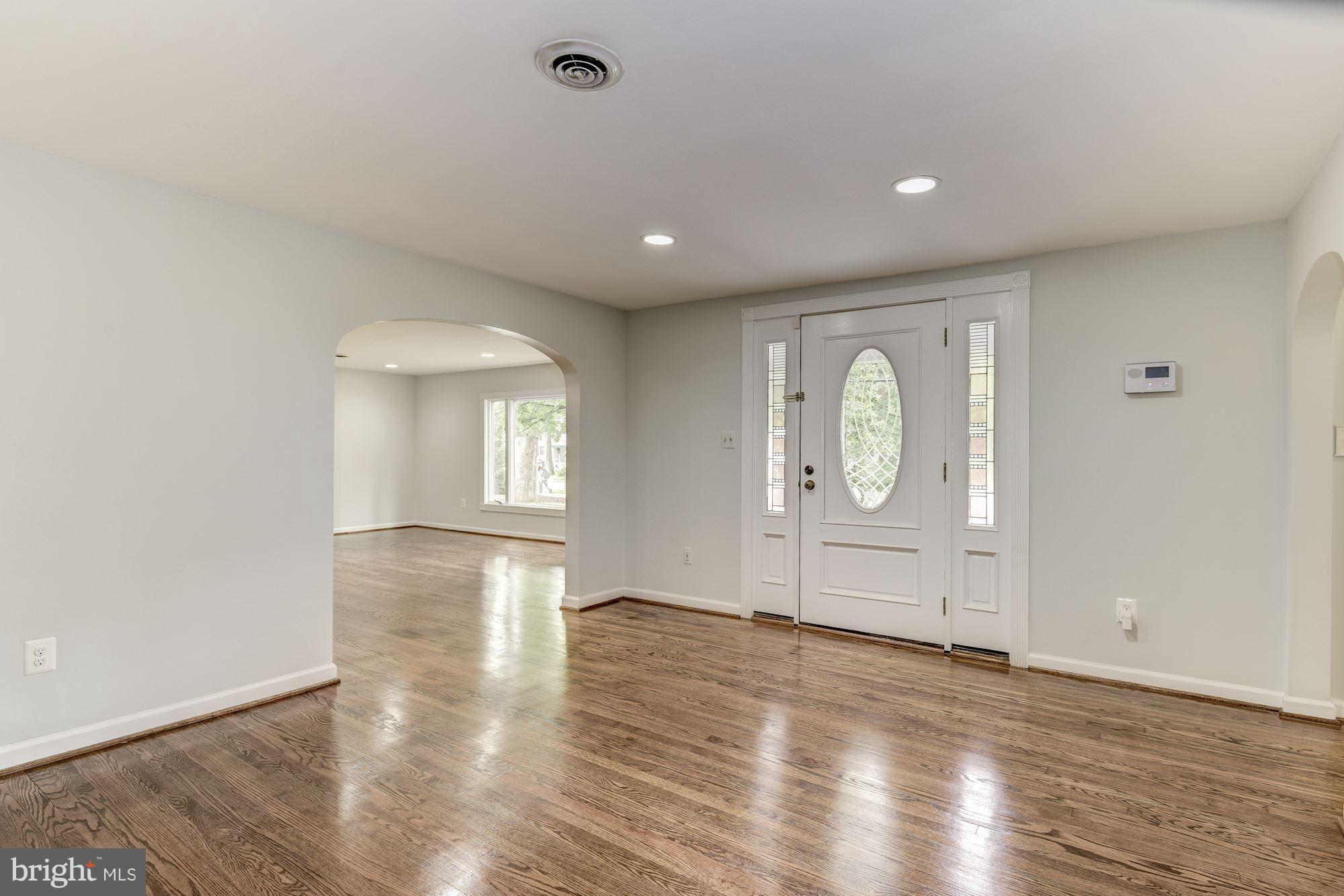 7729 Schelhorn Road Alexandria, VA 22306 - Photo 4 of 30 Gleaming entry features a fireplace