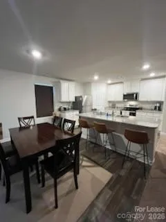 a view of a dining room with furniture
