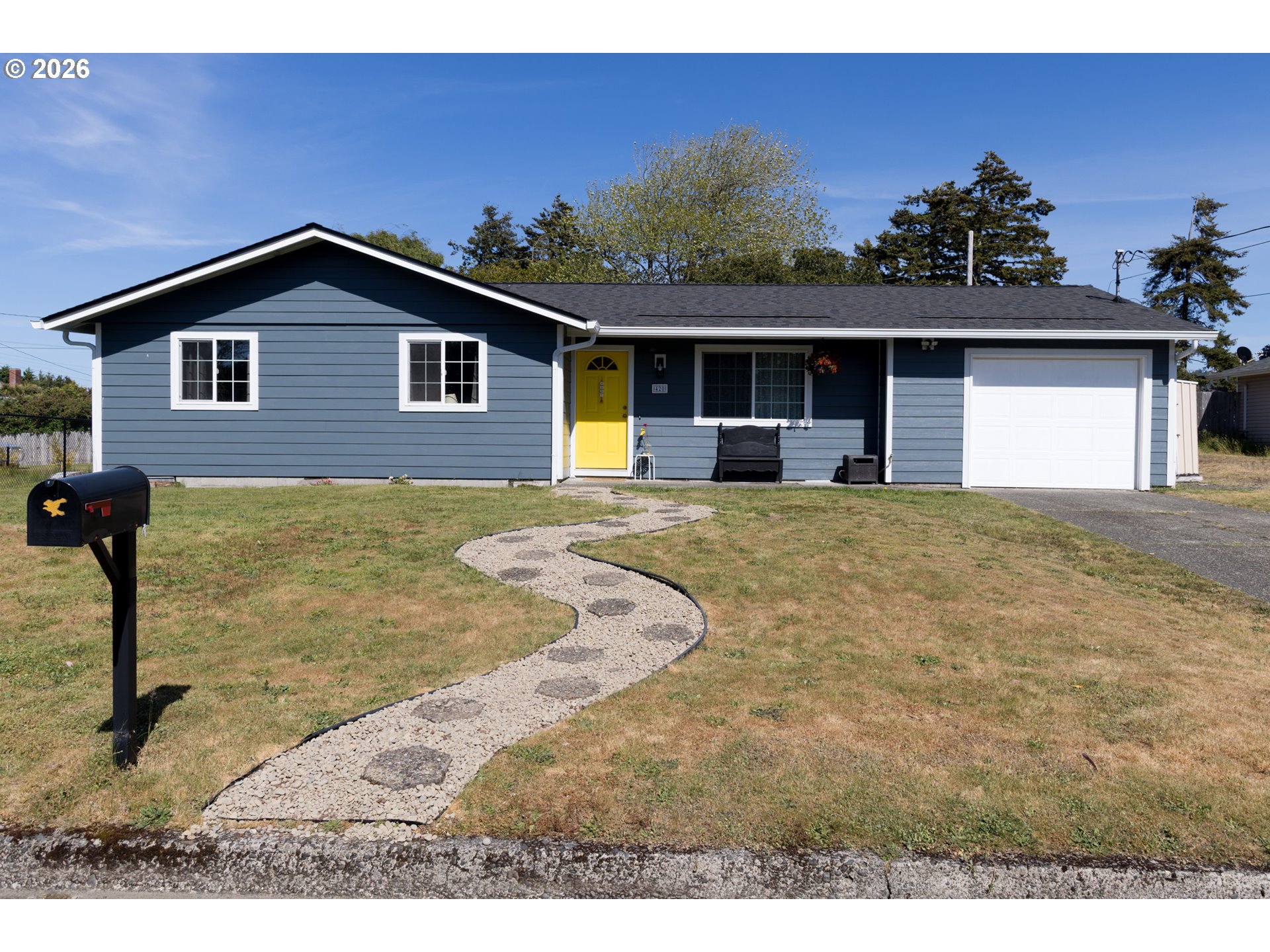 420 Juniper Street Florence, OR 97439 - Photo 1 of 34 a view of a house with a backyard