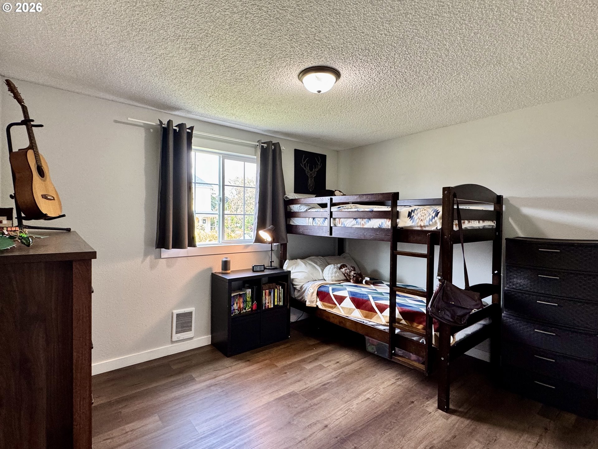 420 Juniper Street Florence, OR 97439 - Photo 22 of 34 a bedroom with furniture and a window