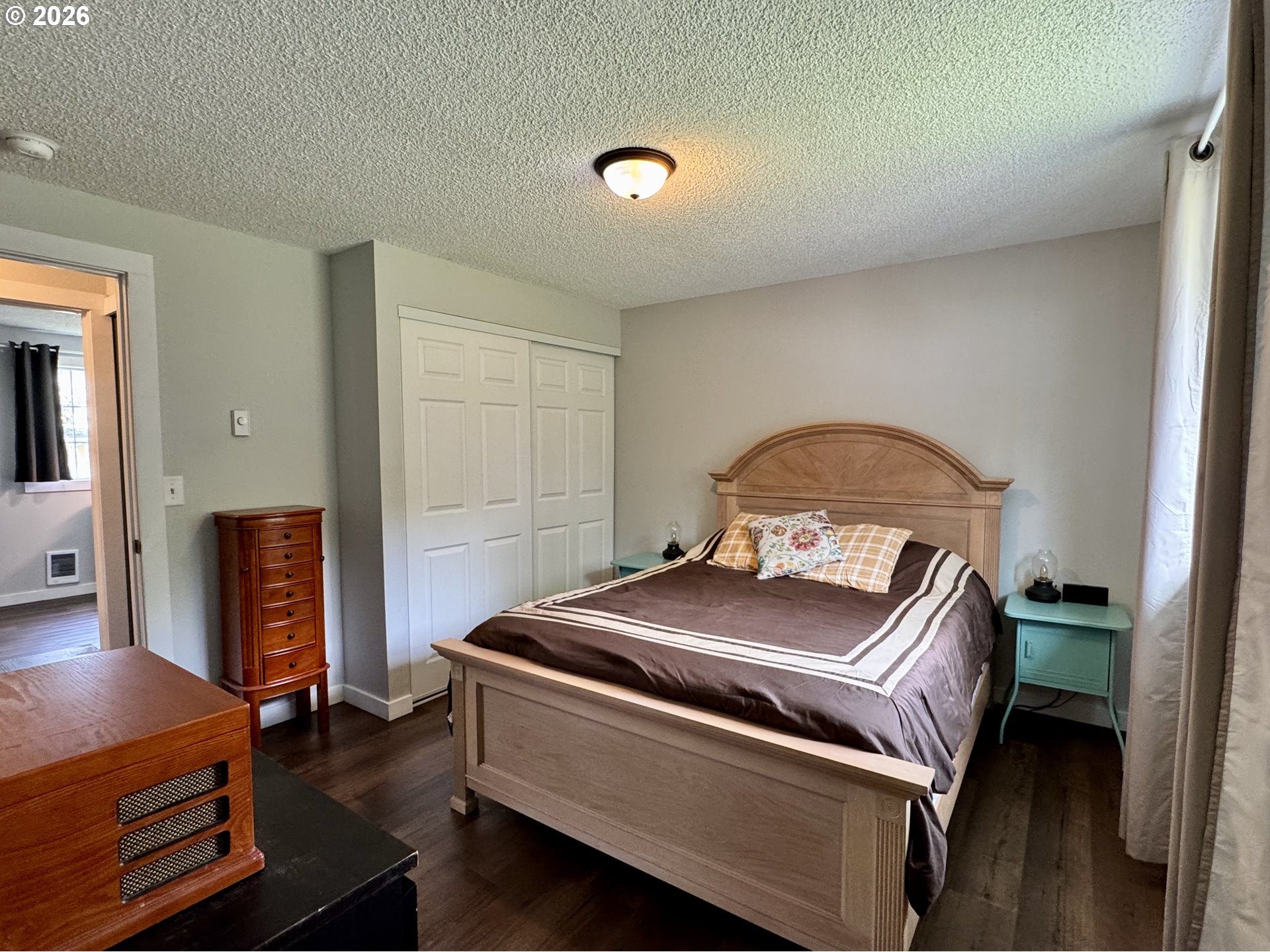 420 Juniper Street Florence, OR 97439 - Photo 24 of 34 a bedroom with a bed and a closet