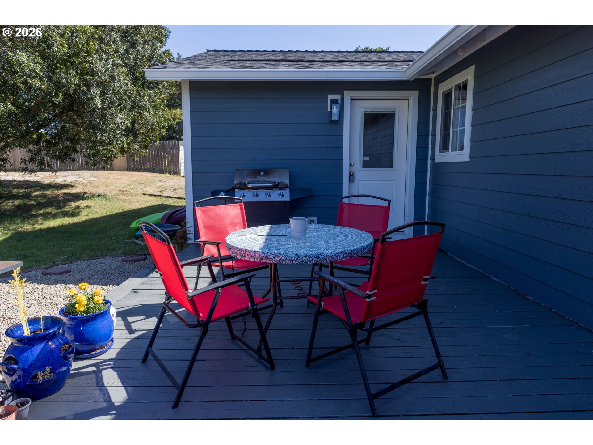 420 Juniper Street Florence, OR 97439 - Photo 27 of 34 a view of a chairs and table in the patio
