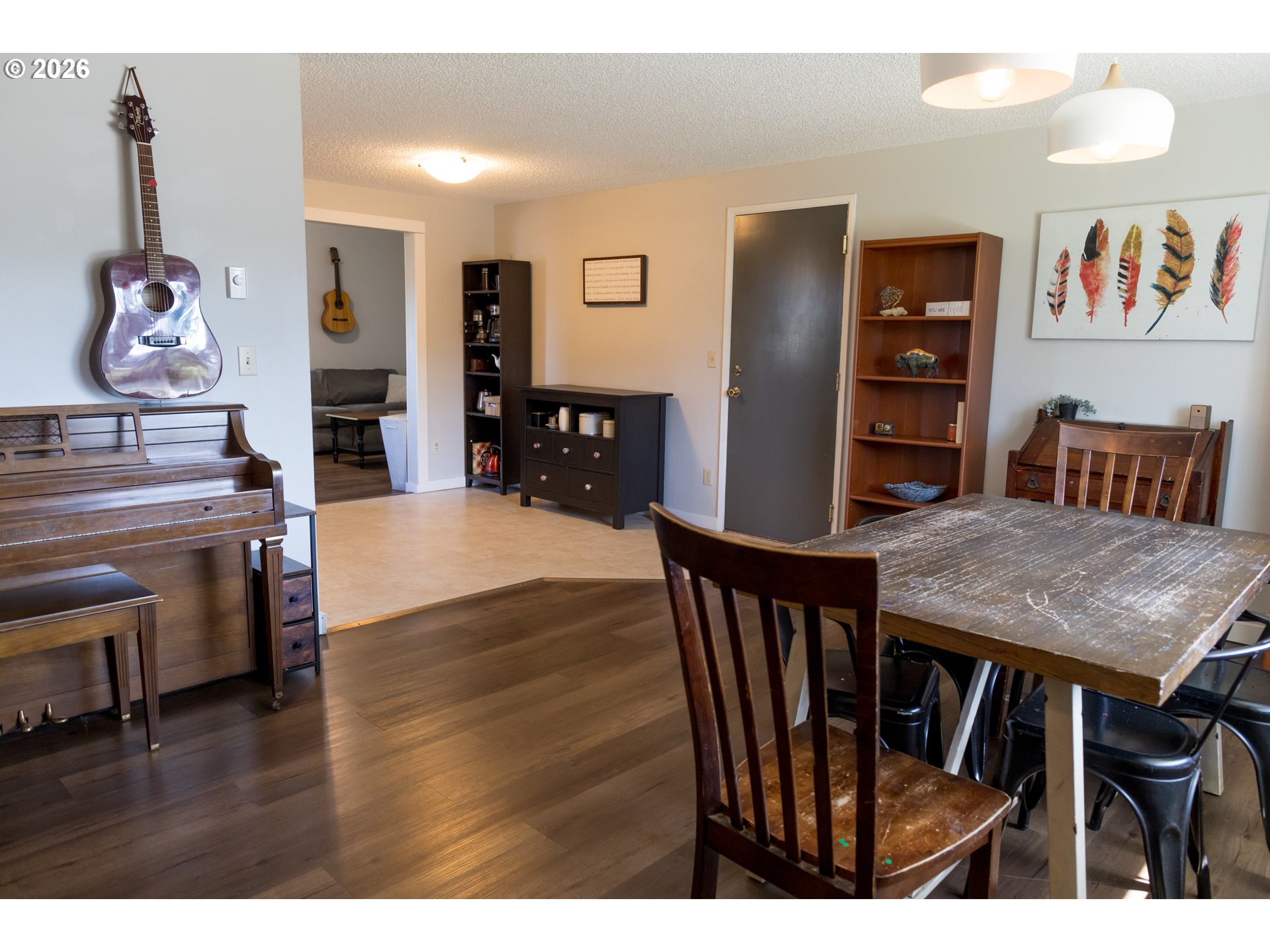 420 Juniper Street Florence, OR 97439 - Photo 3 of 34 a view of a dining room with furniture and wooden floor
