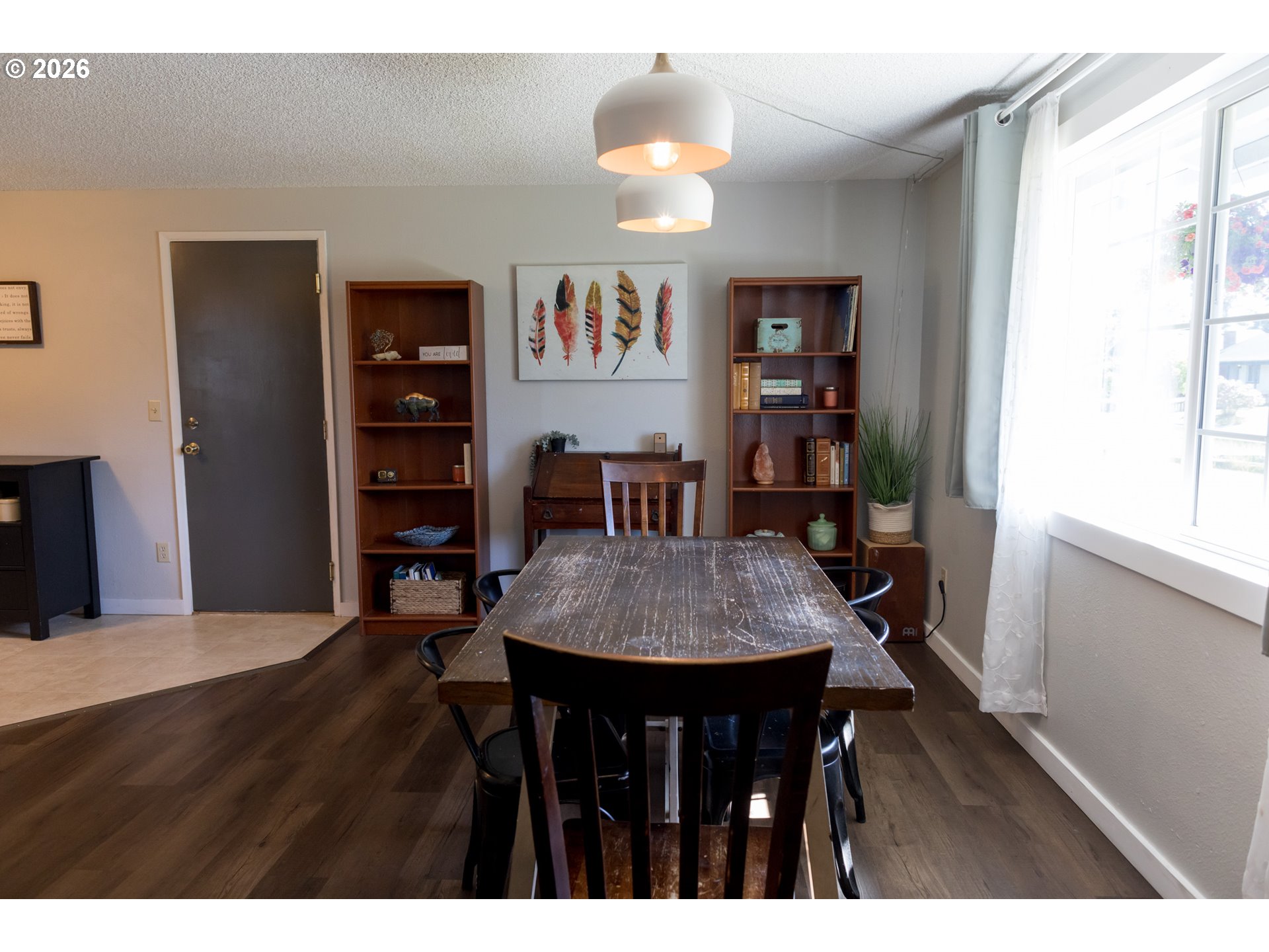 420 Juniper Street Florence, OR 97439 - Photo 4 of 34 a view of a dining room with furniture and wooden floor