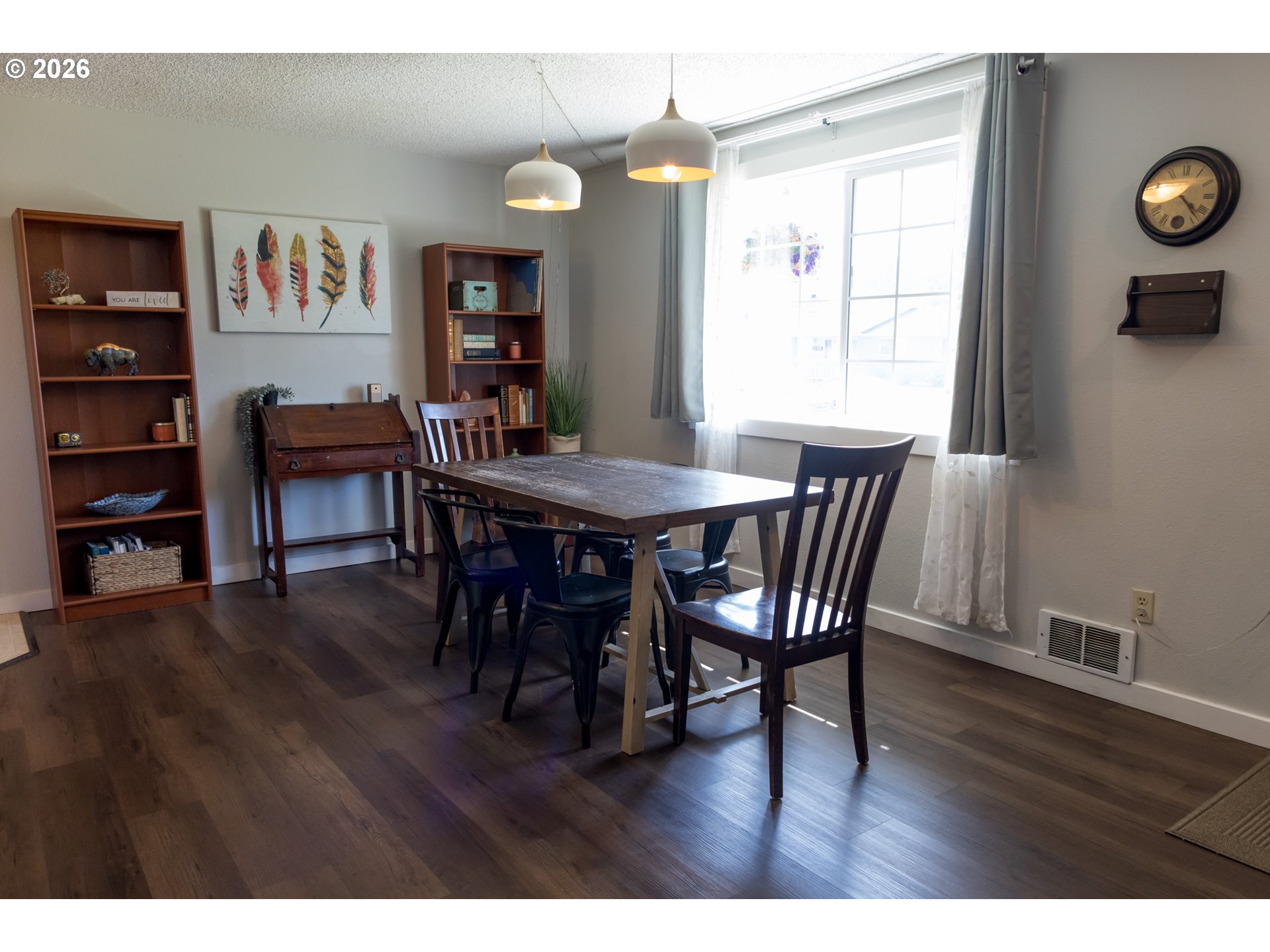 420 Juniper Street Florence, OR 97439 - Photo 5 of 34 a view of a dining room with furniture and wooden floor