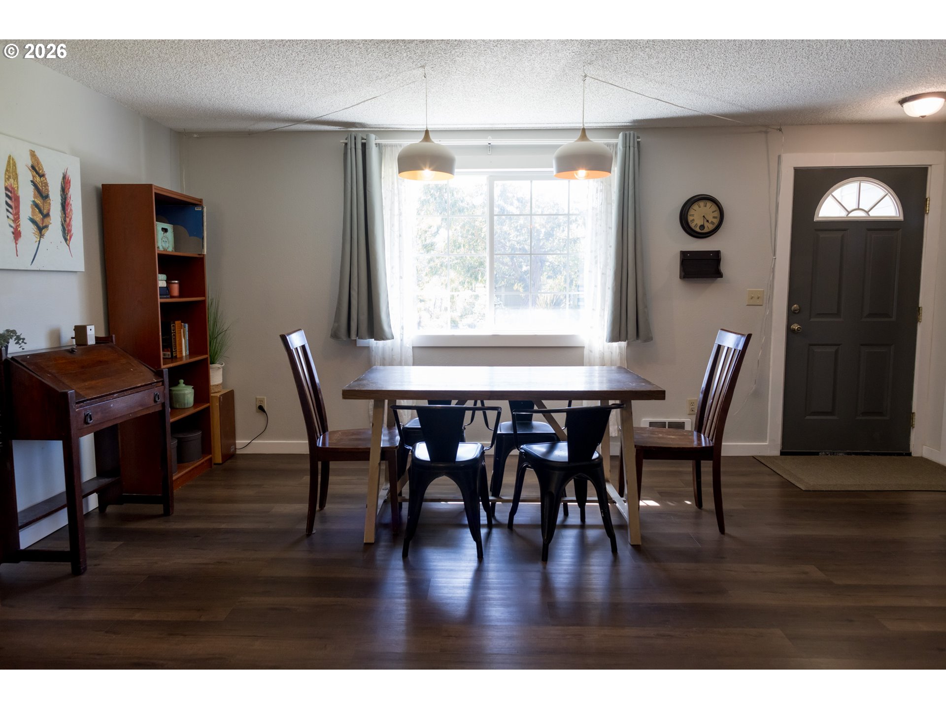 420 Juniper Street Florence, OR 97439 - Photo 6 of 34 a view of a dining room with furniture and wooden floor