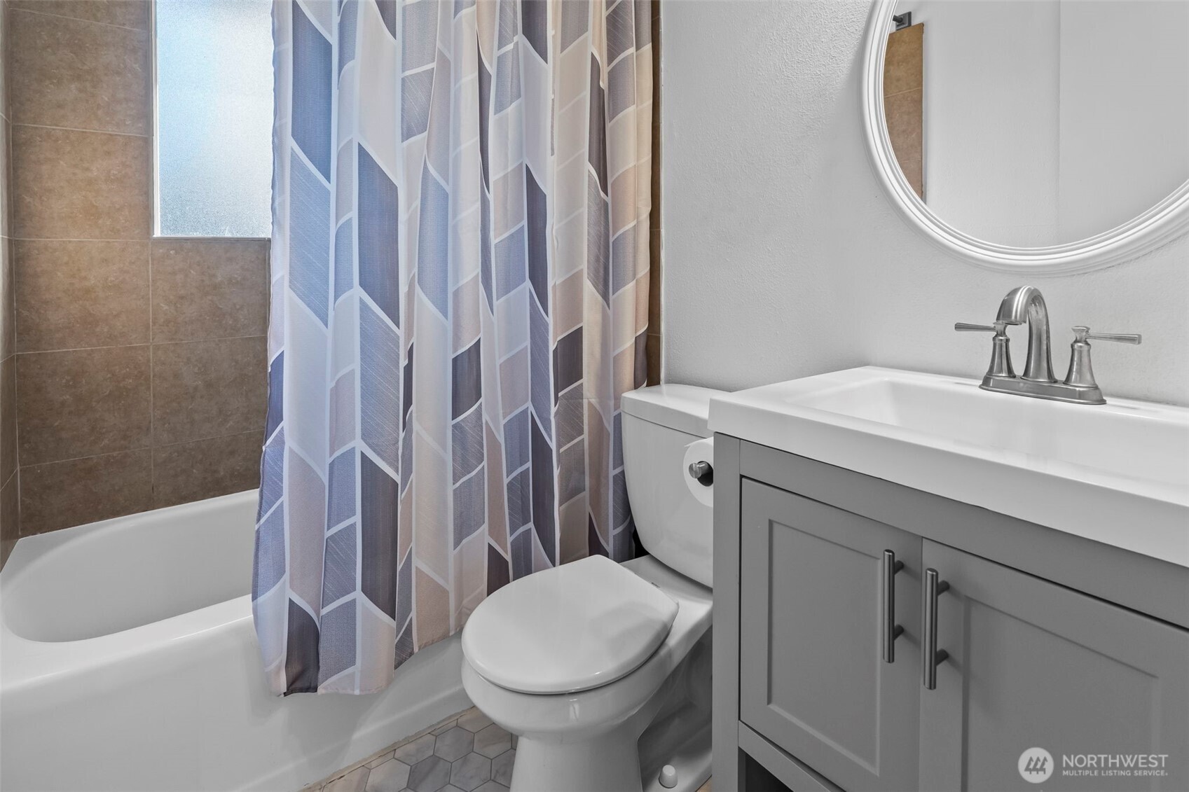 8809 Meadow Road Southwest Lakewood, WA 98499 - Photo 13 of 33 a bathroom with a sink toilet and shower