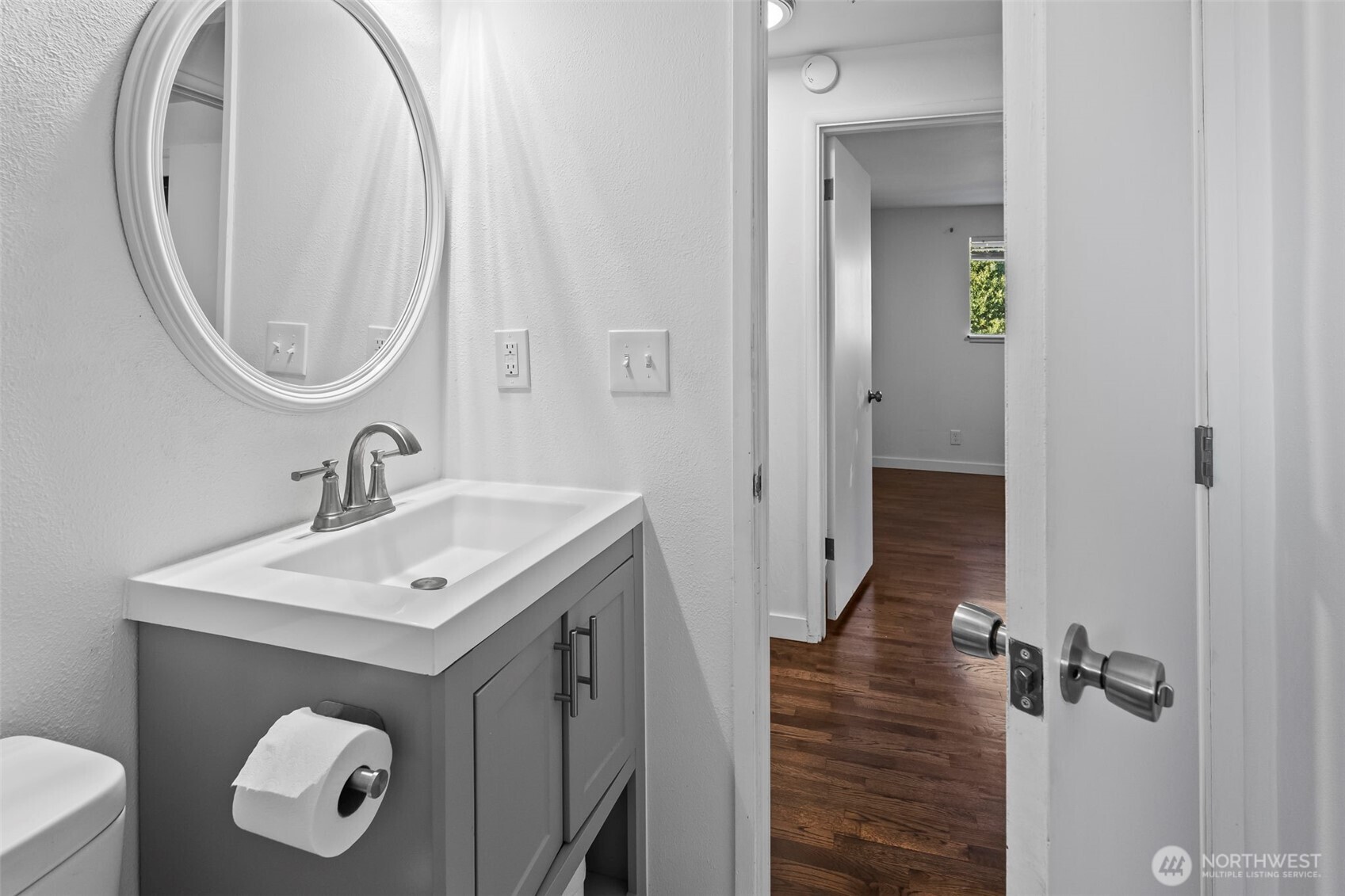 8809 Meadow Road Southwest Lakewood, WA 98499 - Photo 14 of 33 a bathroom with a sink and a mirror
