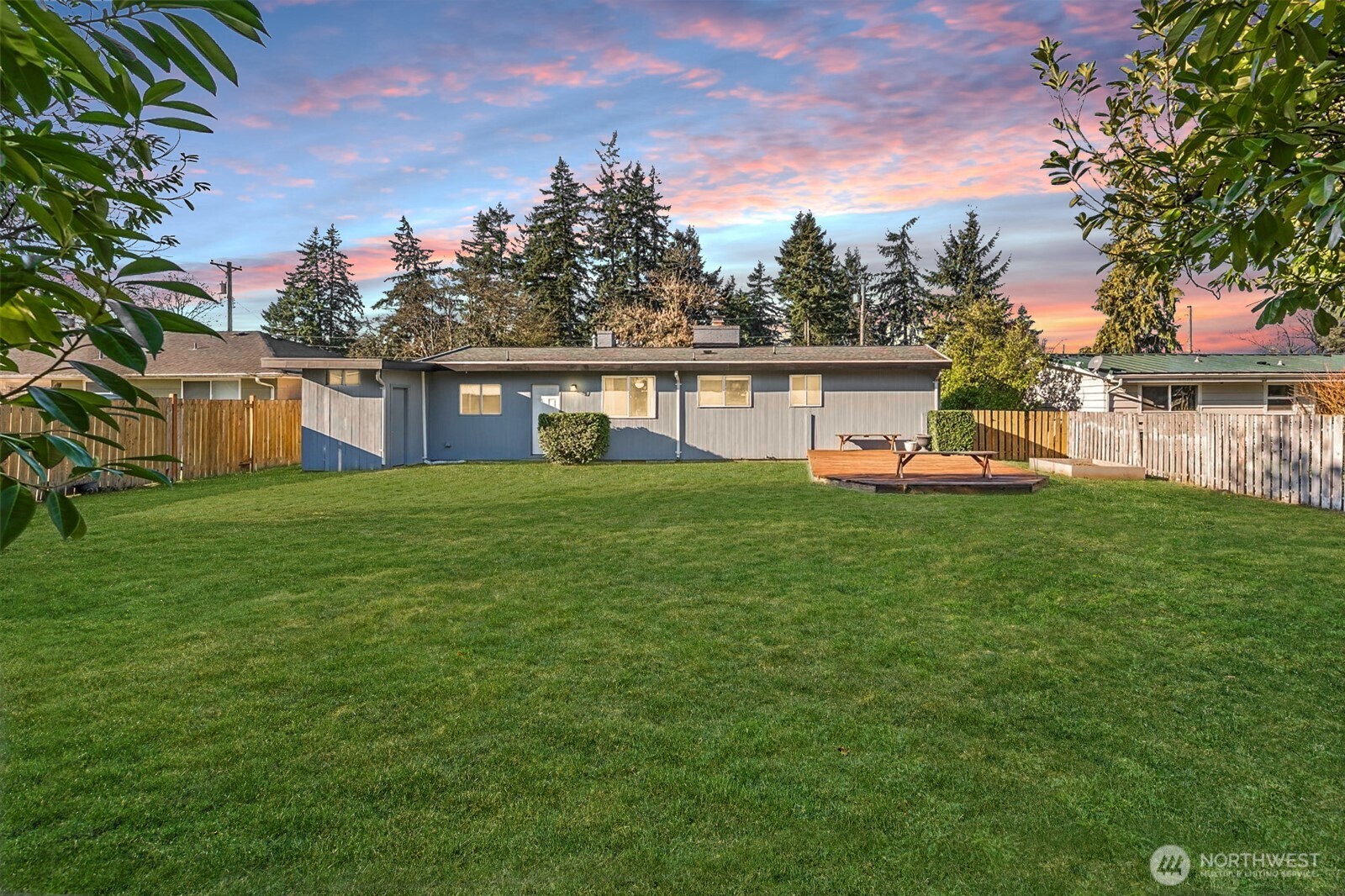8809 Meadow Road Southwest Lakewood, WA 98499 - Photo 22 of 33 a view of a house with a big yard