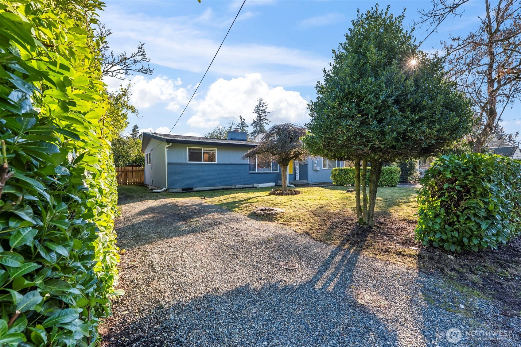 8809 Meadow Road Southwest Lakewood, WA 98499 - Photo 26 of 33 a view of a house with a yard